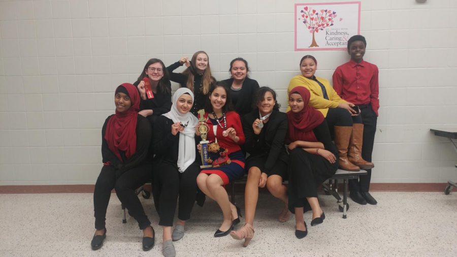 The 2019 Columbia Heights High School Speech Team, led by Maria Hernandez (center).