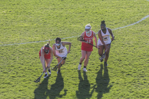 Jessica Perez (11) drives for a ground ball in the first game of the CHHS girls lacrosse season. 