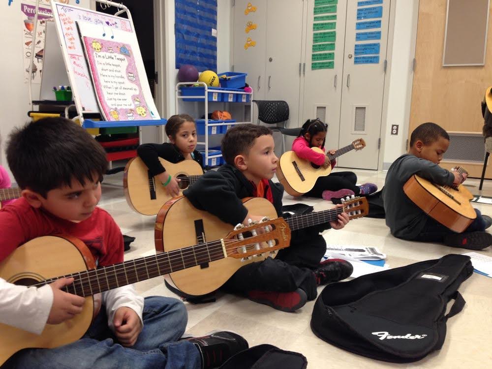 Guitar is just one instrument LEAP students get to learn how to play in Highlands elementary music class.