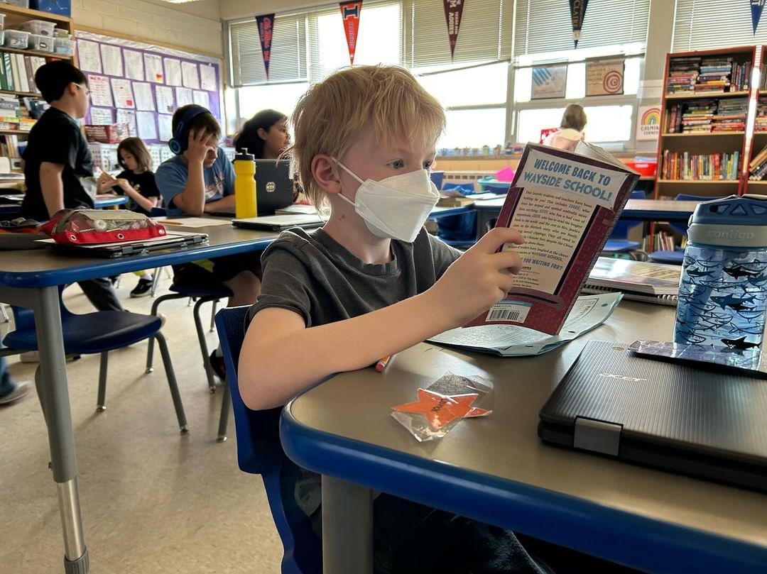 Junior reporter Lennox Polley enthusiastically reads yet another book in Ms. Kerbers LEAP classroom at Highland Elementary.