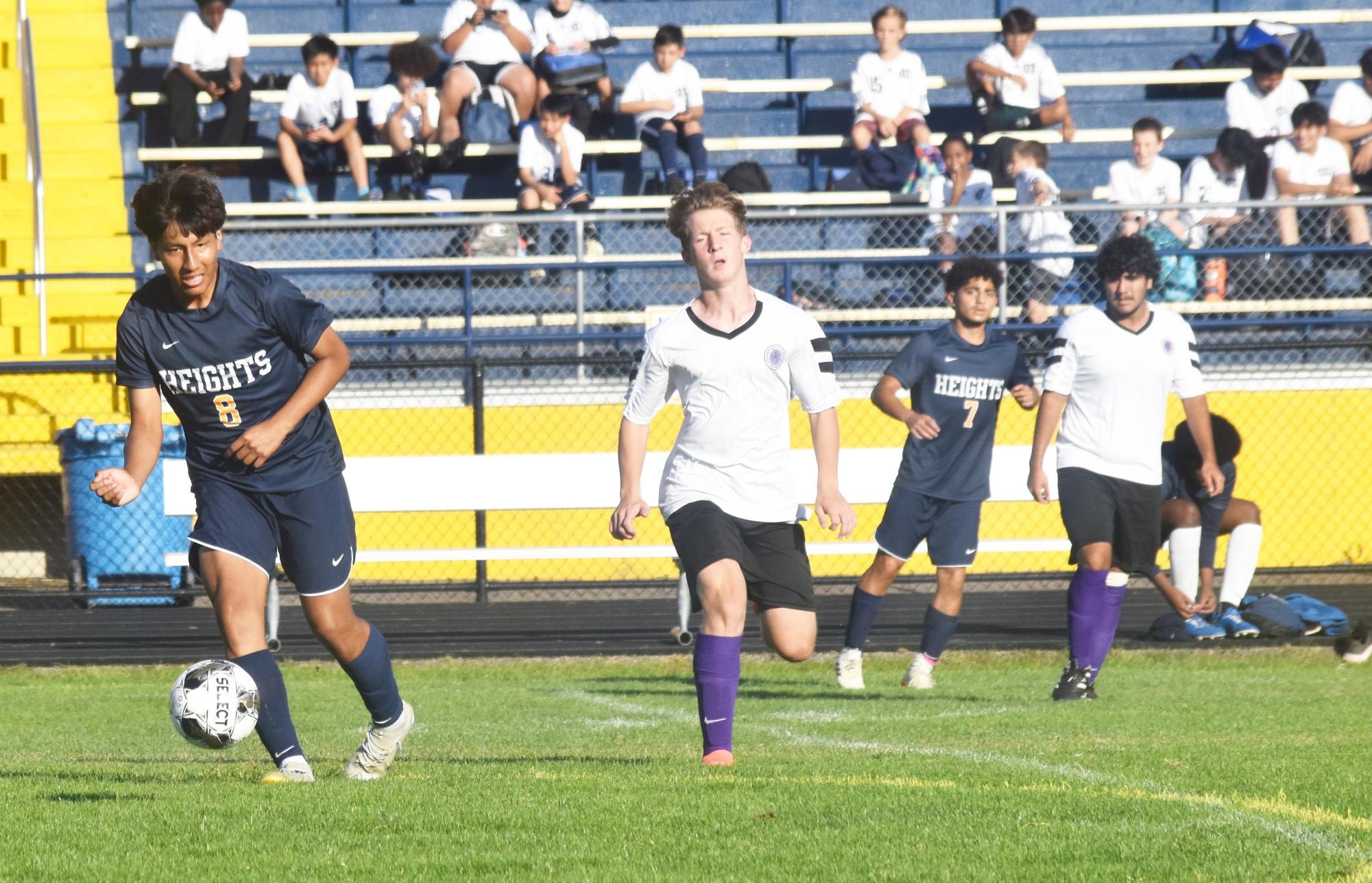 Franklin Chaguan Guaman (12) runs the ball down the field after a pass, escaping from Fridley's defense.