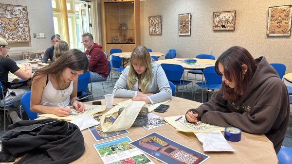 Indigenous CHHS students learn more about their Native American culture by coloring a bandolier bag.