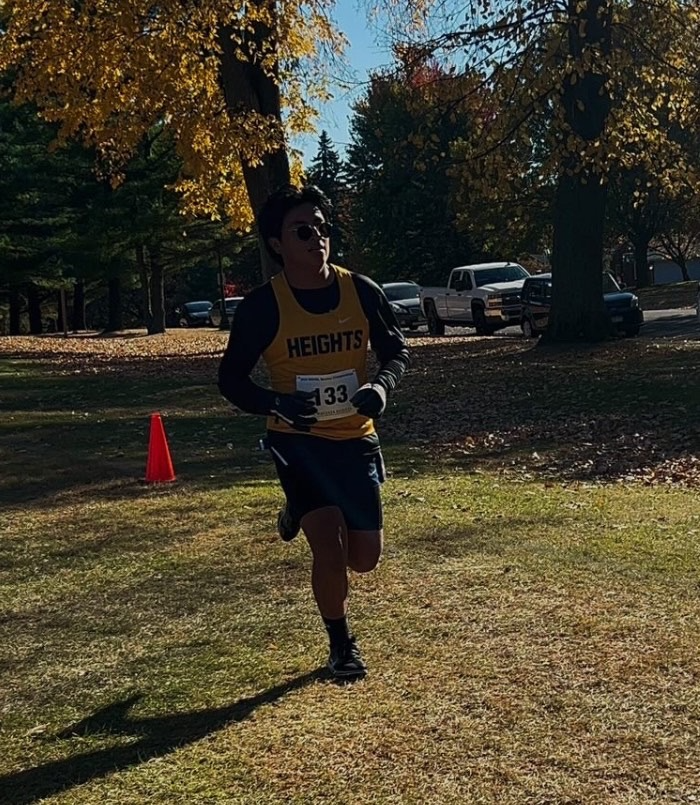 Cole Young (12) goes on the run for a cross country meet.