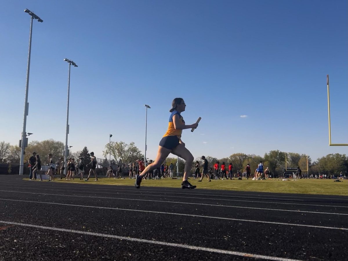 Track and field runner Kimberly Rodriguez Perea (12) goes for a breath-taking jog.