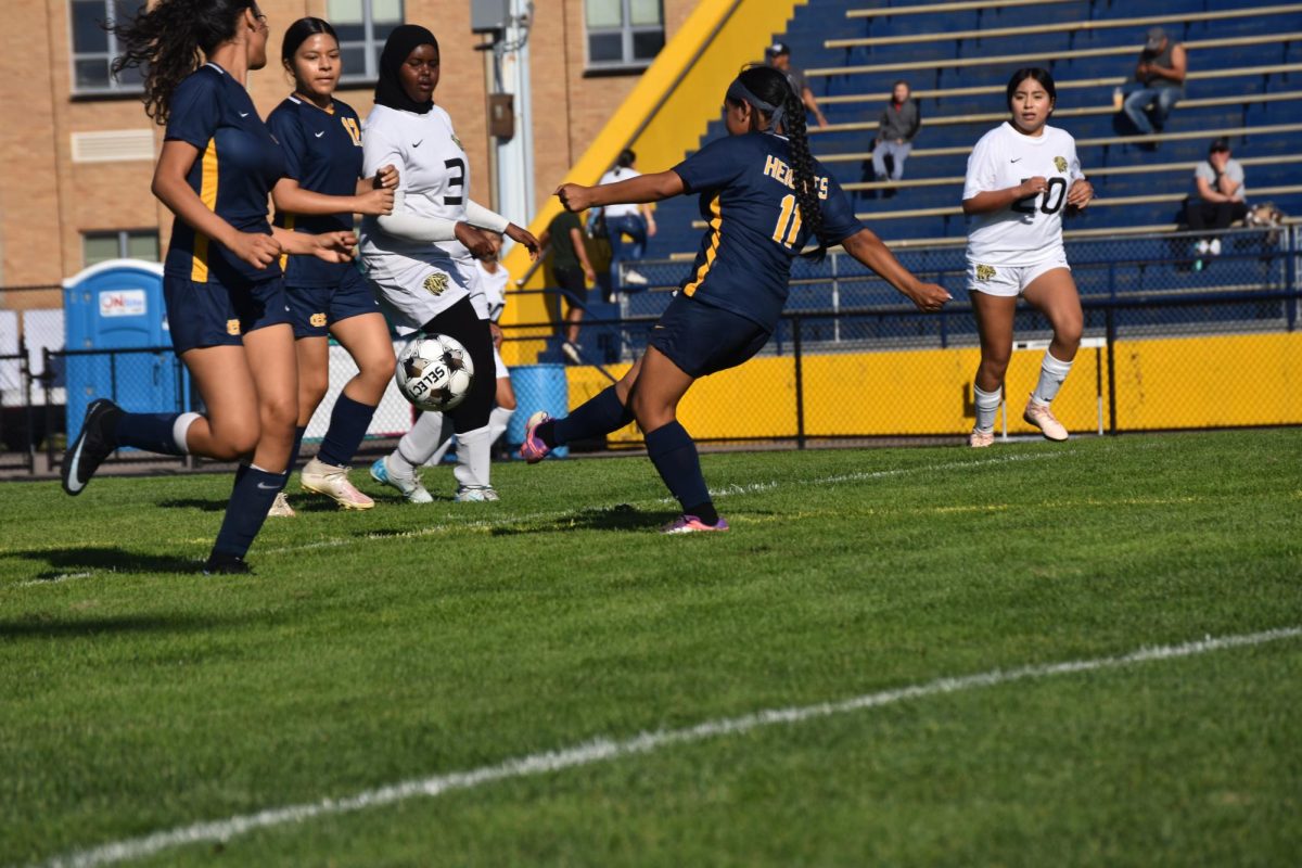 A player passing the ball to her teammate.