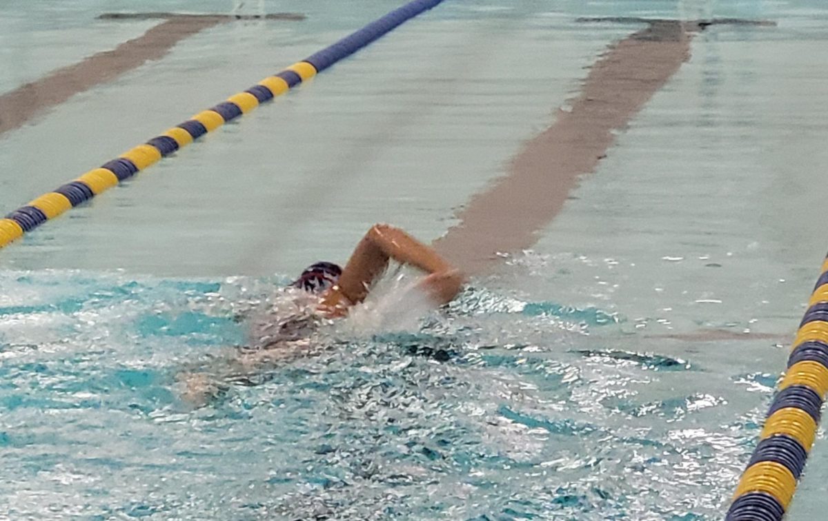 A swimmer practicing their drills