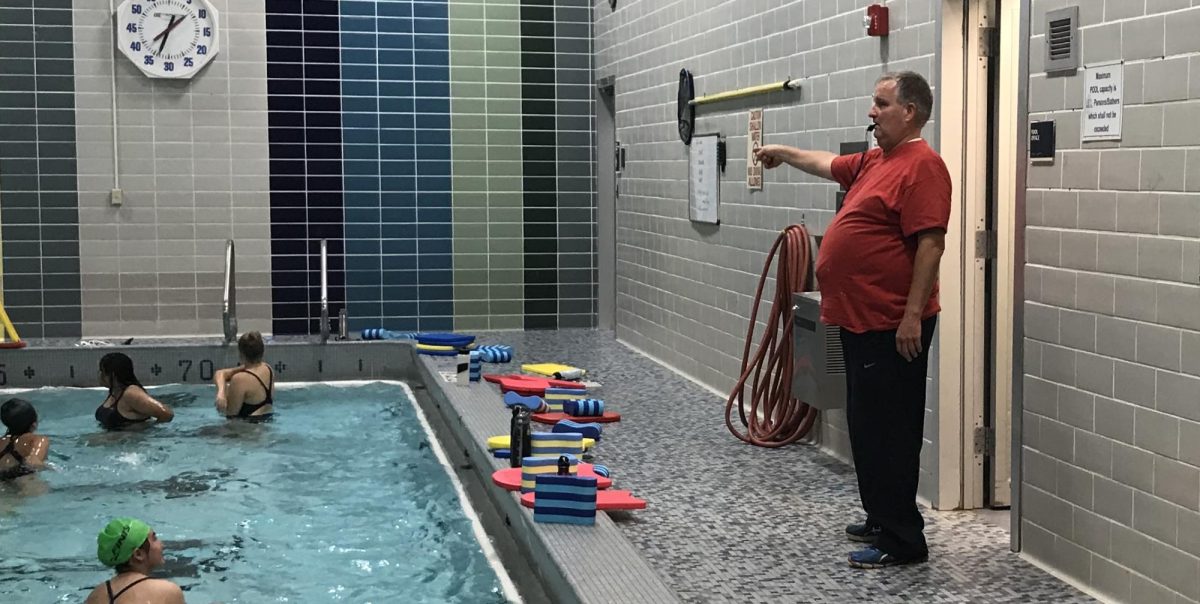 Former swim coach Blair Eckstrom directs the CHHS girls' swim and dive team with his famous point and whistle. 