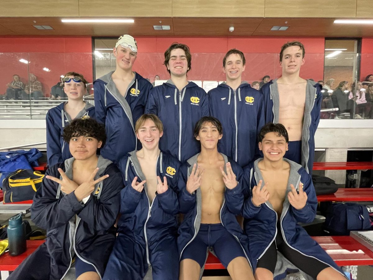 The swim team poses after a successful meet!