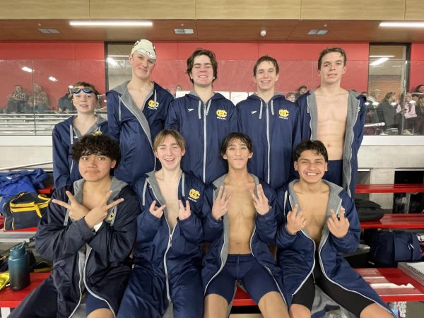 The swim team poses after a successful meet!