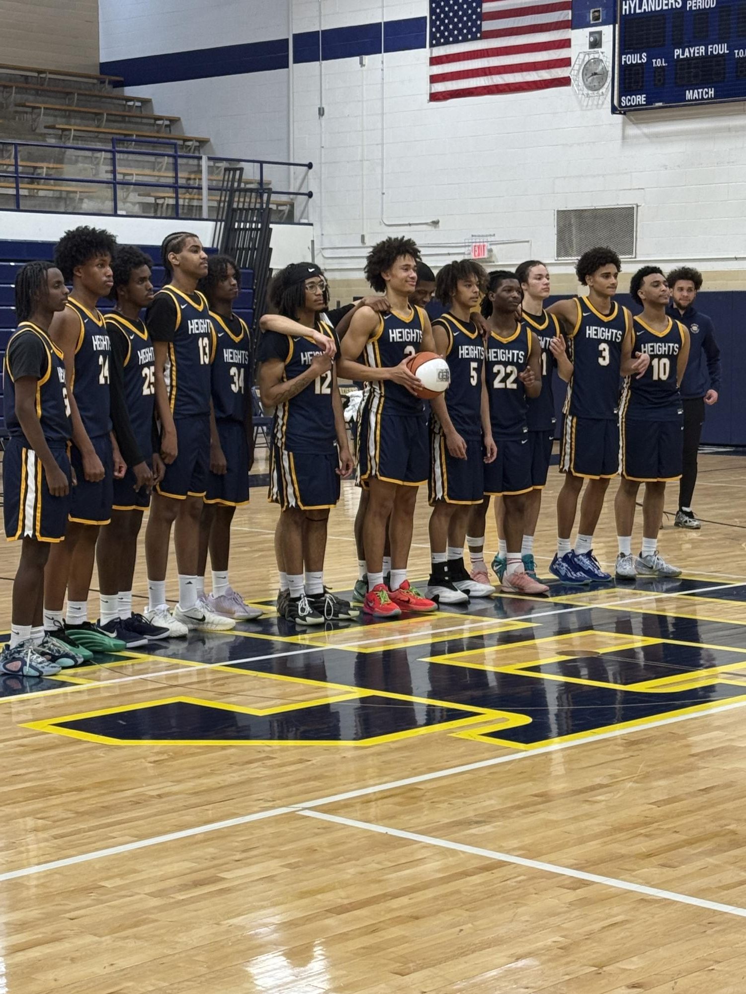The CHHS varsity boys' basketball team doing the Pledge of Allegiance before a game!