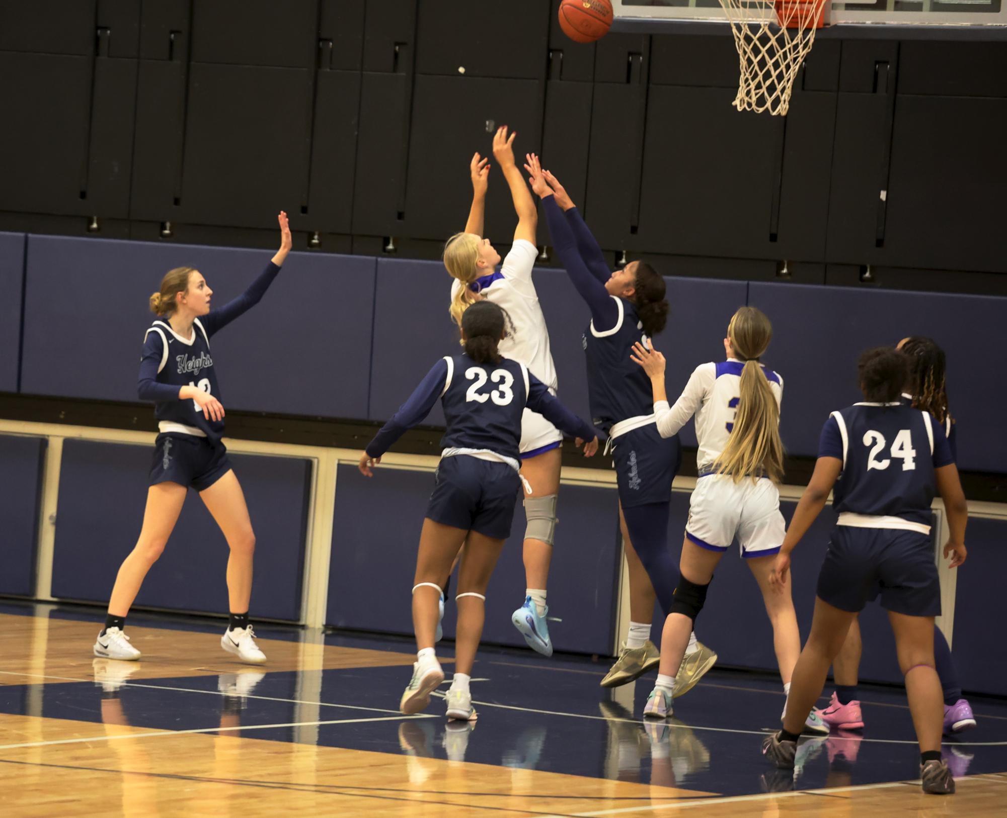 CHHS girls' varsity basketball captain Iris Bergan (12) throws up a two-pointer.