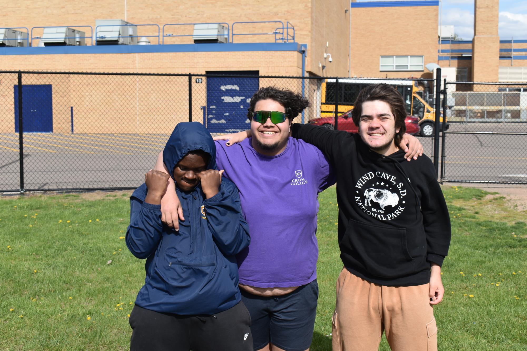 Students Xavier Vital Schwartz, Nour Hussein, and Donzell Baugh posing for a photo 